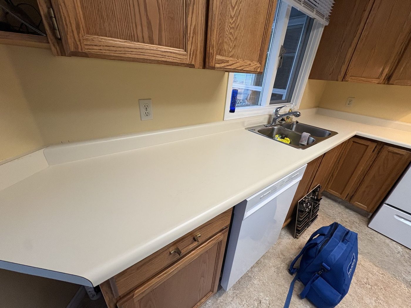 Kelowna kitchen counter before — dated almond laminate