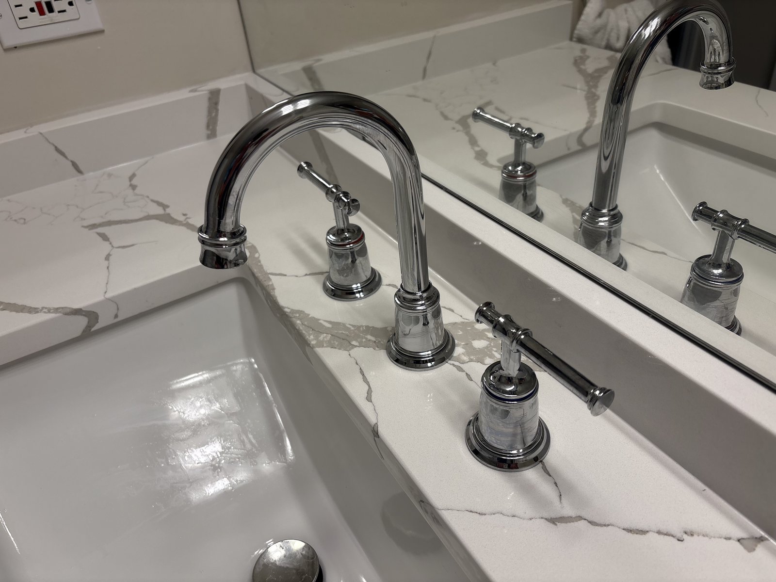 Quartz bathroom vanity with new chrome widespread faucet in Kelowna
